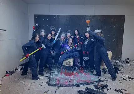 Team participating in a rage room smash experience