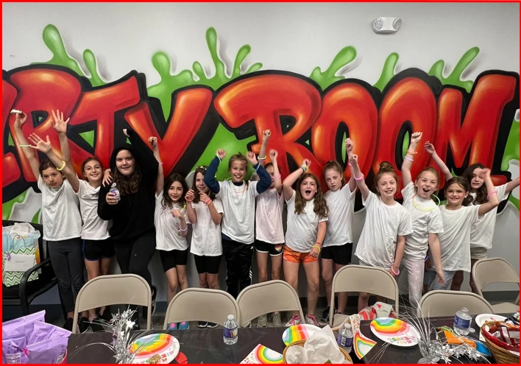 Smash room birthday party group photo