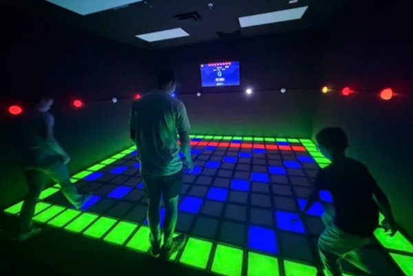 LED gaming room with illuminated dance floor attraction